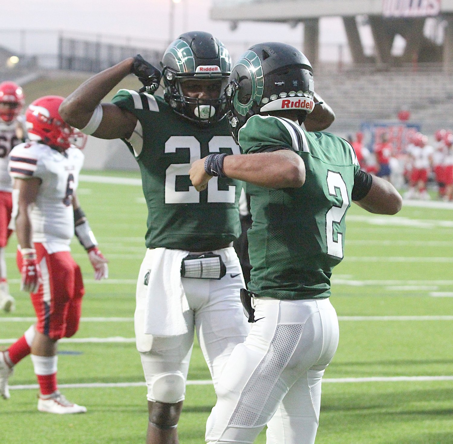 Mayde Creek senior receiver L'Den Skinner (22) celebrates with senior quarterback Jace Wilson (2) after Wilson's touchdown during the Rams' non-district game against Dulles on Oct. 8, 2020, at Legacy Stadium.